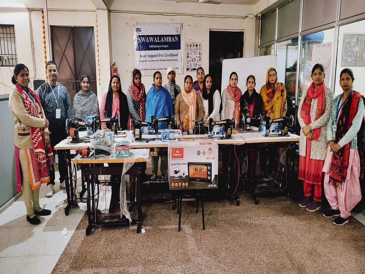 Women with livelihood equipment provided through a CWS enterprise-support initiative