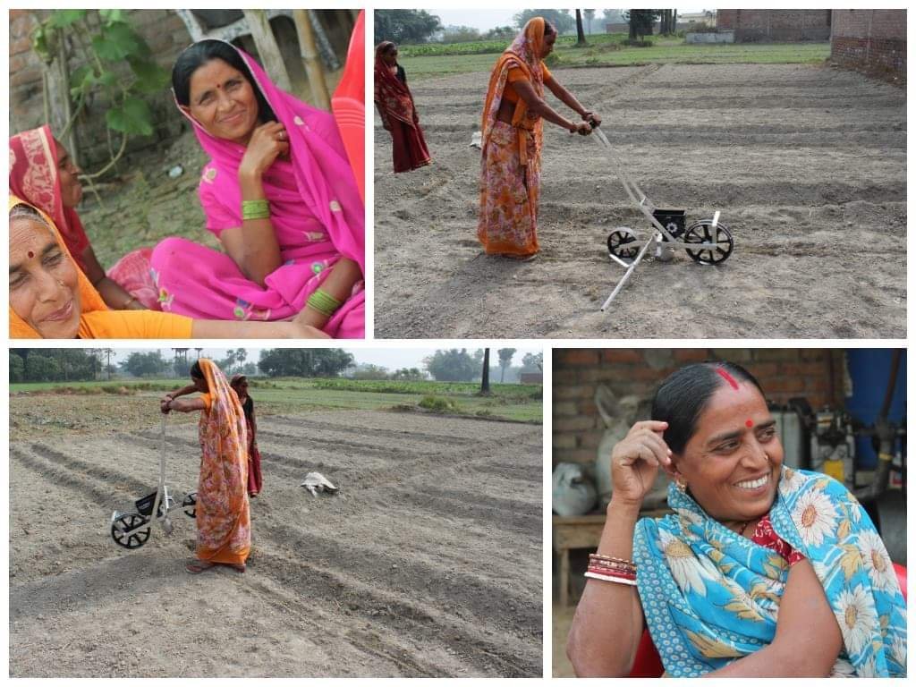 Women farmers learning to use a small wheeled farm machine.