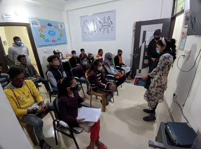 A teacher leads a small remedial class.