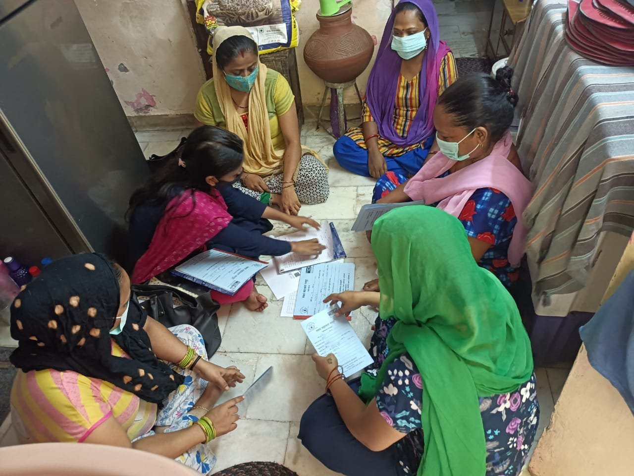 Members checking group forms together.