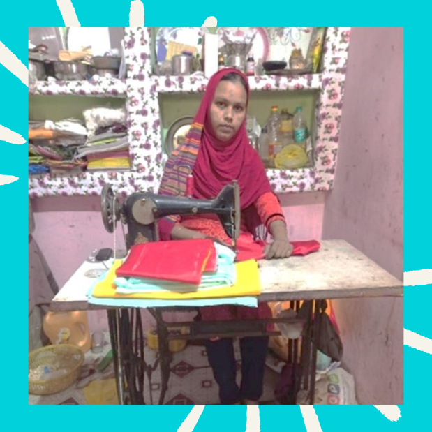 Saliman seated at a sewing machine in her home workspace