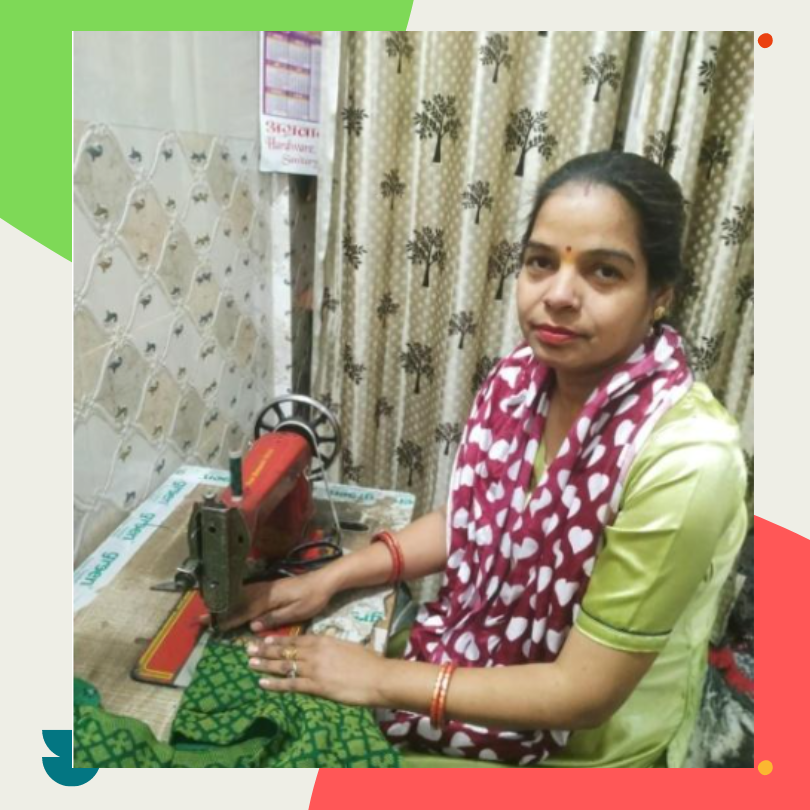 Seema working with fabric at a sewing machine